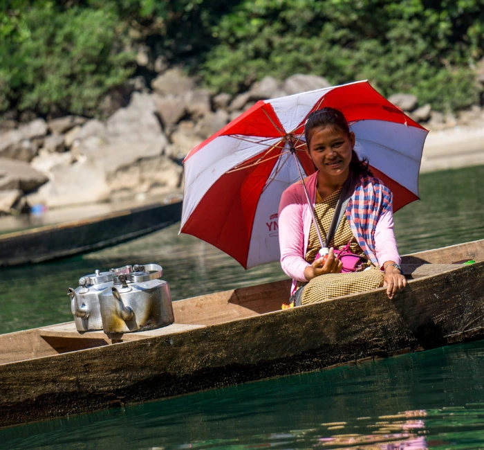 People outside a traditional home in Northeast India