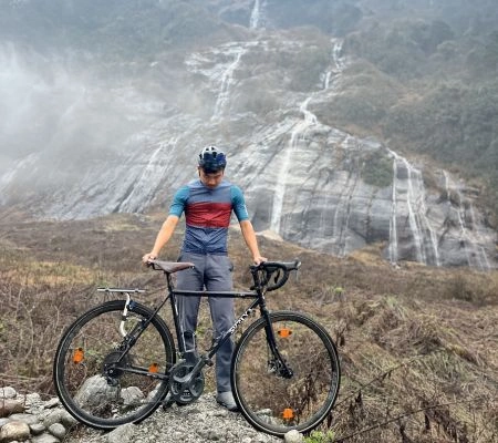 Raikom with a bicycle in the hills