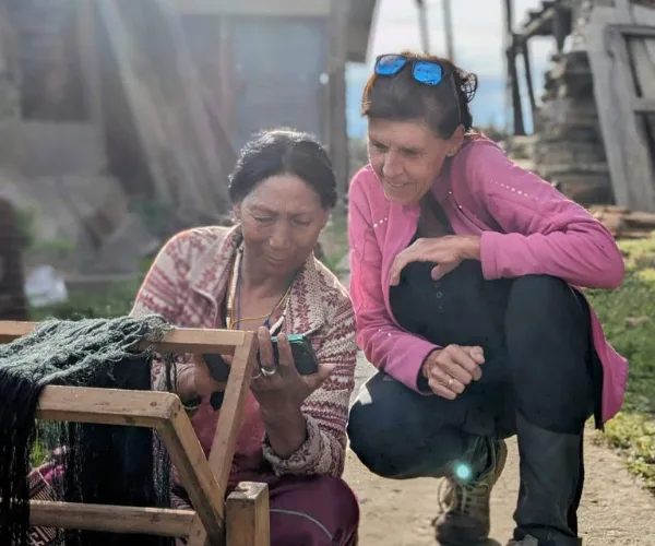 Traveller learning from a basket maker in Arunachal Pradesh