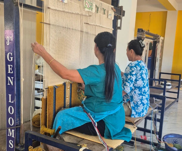 Learning about traditional weaving during an educational youth expedition