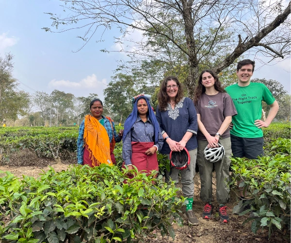 Family travellers with tea garden hosts on an Assam holiday