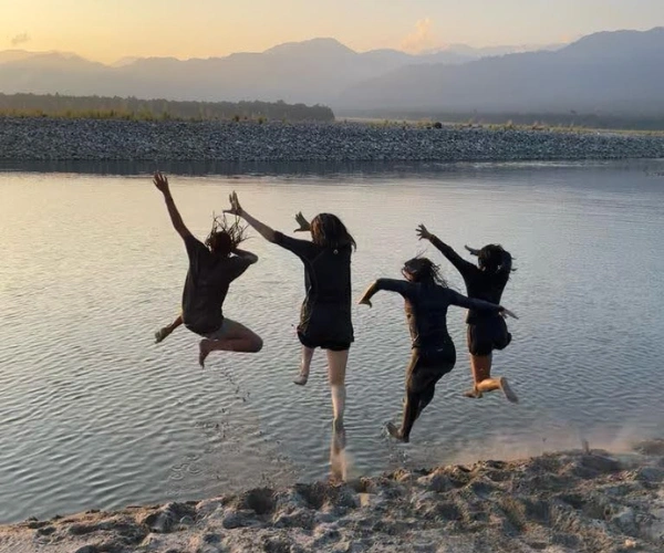 Children jumping into the river on an Arunachal family adventure