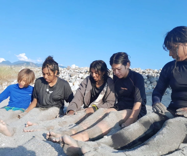 Children relaxing on a river beach during an Arunachal family adventure holiday