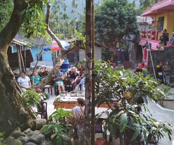 Youth travellers sharing a community meal in a Meghalaya village