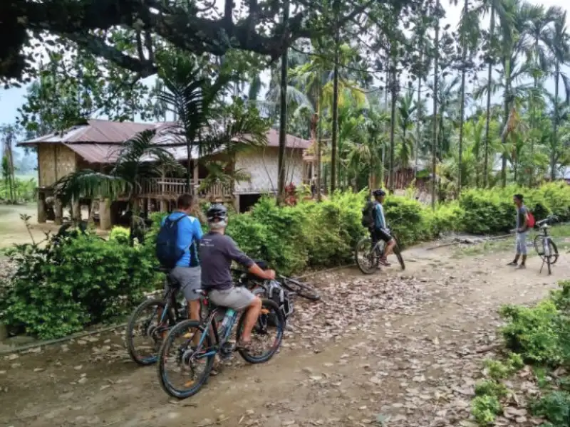 Cyclists in an Eastern Arunachal village