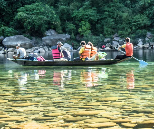 Boating on clear river pools in Meghalaya