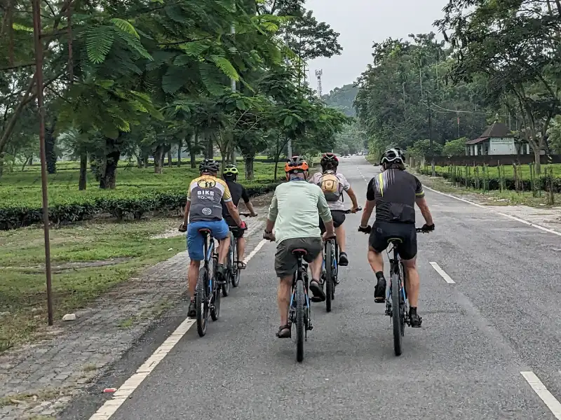 Cyclists riding from Assam toward Arunachal Pradesh