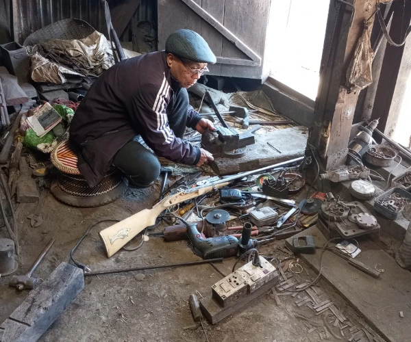 Craftsperson working inside a traditional home