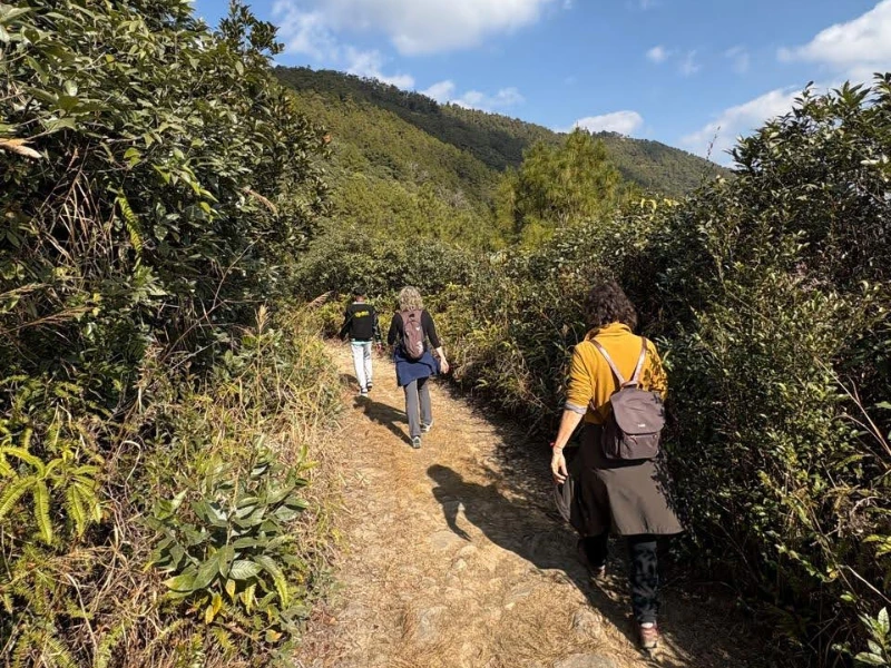 Walkers meeting local families in a Meghalaya village