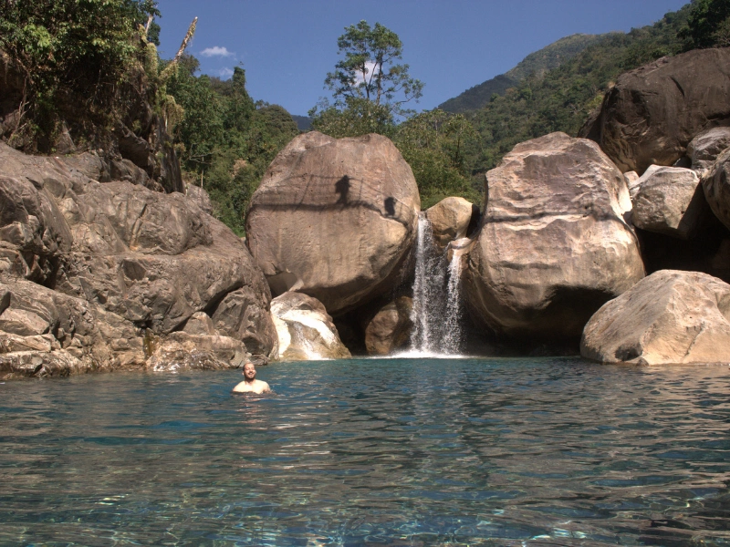 Natural pool and waterfall in Meghalaya during the walking tour