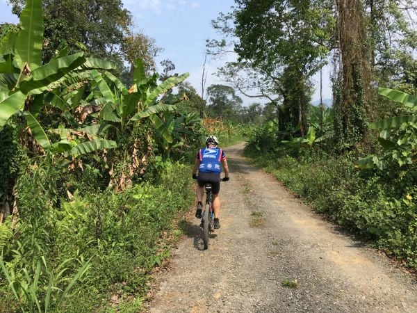 Cyclist riding a rural lane in eastern Arunachal Pradesh