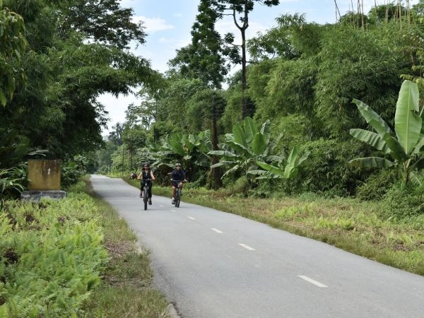 Two cyclists on a forest road in Arunachal Pradesh