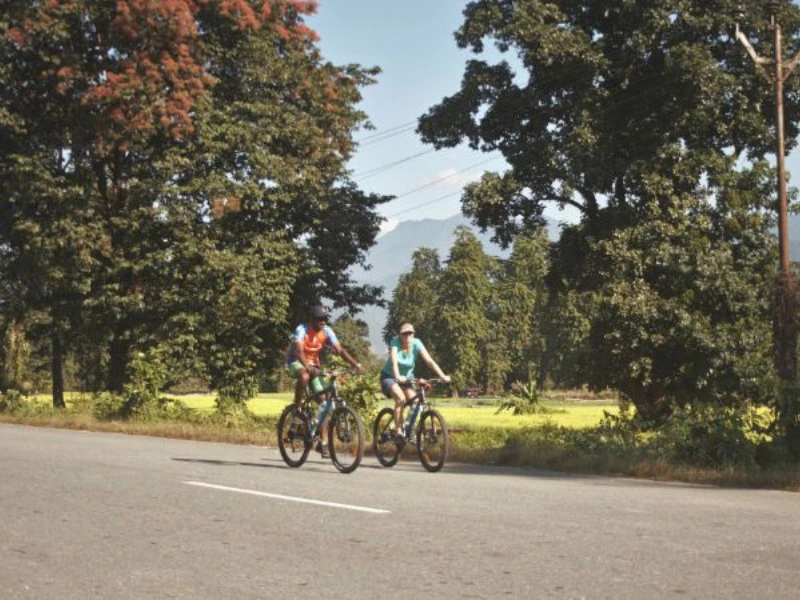 Two cyclists riding a forest road in Eastern Arunachal Pradesh